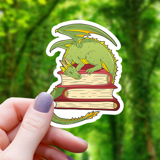 Dragon Sleeping On Red Books Sticker - 3"